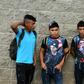 Hondurans bound for the US gather outside a bus station in San Pedro Sula, 180 km north of the capital Tegucigalpa