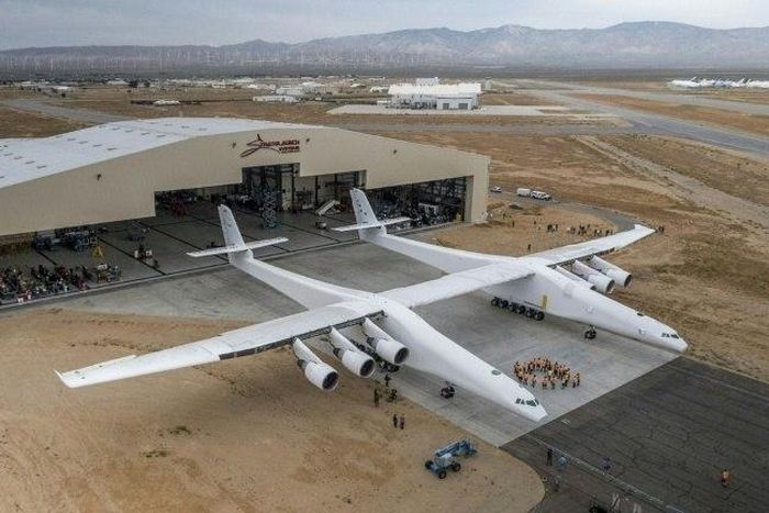The Stratolaunch plane is pushed out of the hanger for the first time in the Mojave desert, California on May 31, 2017