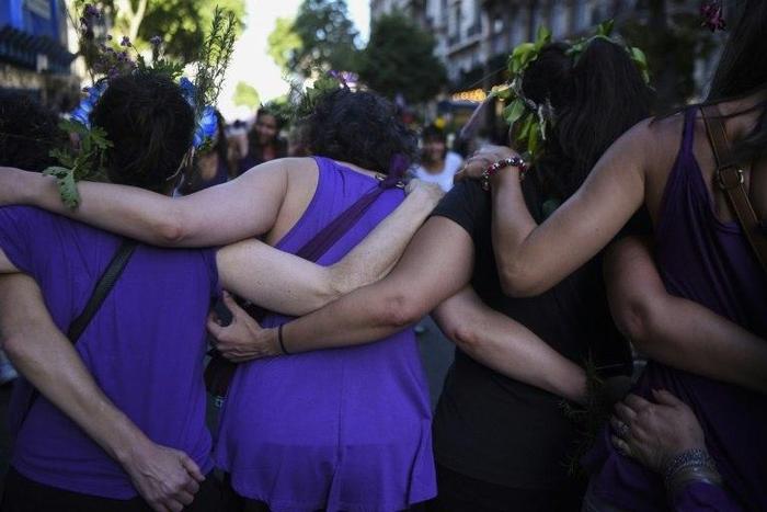 Activists march during the commemoration of the International Day for the Elimination of Violence Against Women in Buenos Aires on November 25, 2016, with other marches planned in Chile, Uruguay, Colombia, Venezuela, Guatemala and Peru