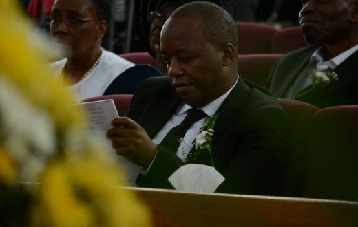 Janet Kanini's husband during her requiem service