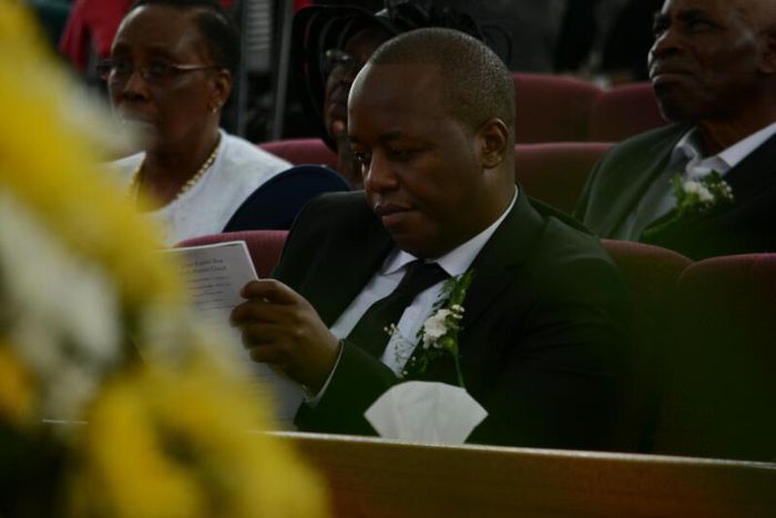 Janet Kanini's husband during her requiem service