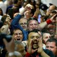 Malta's Minister within the Office of the Prime Minister, Konrad Mizzi (C) celebrates with Labour Party's supporters the results of Malta's general election on June 4, 2017 at a polling station in Naxxar