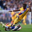Crystal Palace's Wilfried Zaha (up) vies with Chelsea's English defender Gary Cahill during their English Premier League football match in London on April 1, 2017