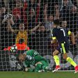 Arsenal's Alexis Sanchez (R) scores the opening goal past Southampton goalkeeper Fraser Forster on the way to a 2-0 Arsenal win