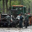 Afghan security personnel investigate the site of a suicide attack that targeted a foreign forces convoy near the US embassy in Kabul on May 3, 2017