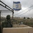 An Israeli soldier stands guard in a monitoring cabin near the West Bank city of Ramallah