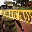 Uganda's police officers cordon off the scene where senior police officer Andrew Felix Kaweesi was murdered in a Kampala Suburb on March 17, 2017