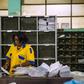 An employee distributes letters and other mail at a branch of the Congolese Company for Posts and Telecommunications in Kinshasa