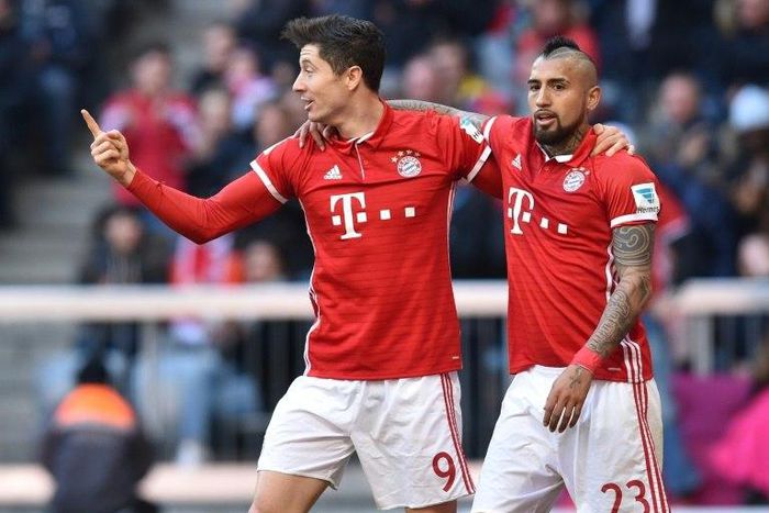 Robert Lewandowski (left) netted twice Bayern Munich went 10 points clear in the Bundesliga