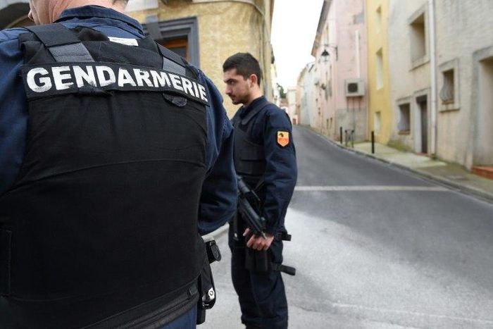 Gendarmes stand guard in a street of Marseillan in southern France, on February 10, 2017, where suspects believed to be involved in plotting an attack were arrested by French anti-terrorist police