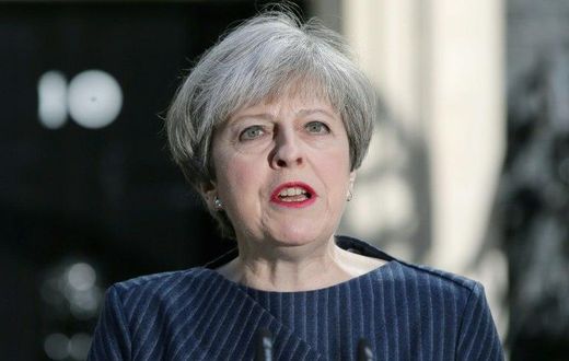British Prime Minister Theresa May makes an announcement to the media outside 10 Downing Street in central London on April 18, 2017