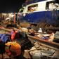 Rescue workers search for survivors in the wreckage of a derailed train near Pukhrayan in Kanpur district, northern India on November 20, 2016
