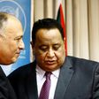 Sudanese Foreign Minister Ibrahim Ghandour (R) speaks with his Egyptian counterpart Sameh Shokry following a joint press conference in Khartoum on April 20, 2017