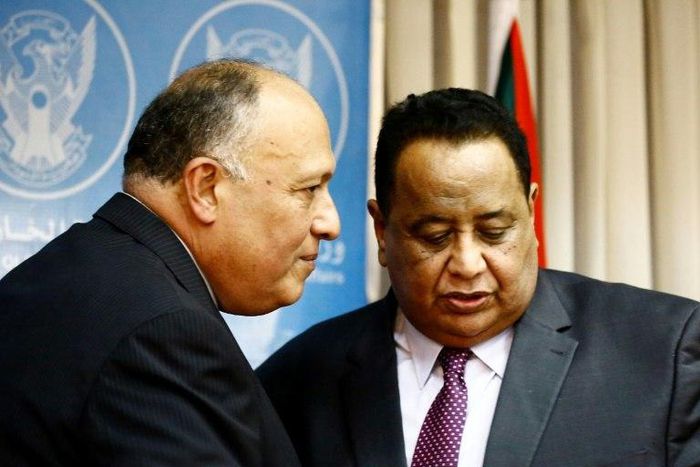 Sudanese Foreign Minister Ibrahim Ghandour (R) speaks with his Egyptian counterpart Sameh Shokry following a joint press conference in Khartoum on April 20, 2017