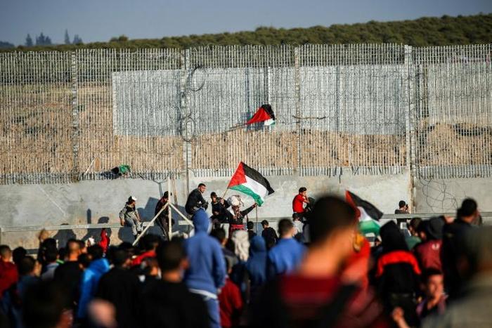 Two Palestinians were killed Friday by Israeli fire on the Gaza border, the enclave's health ministry said