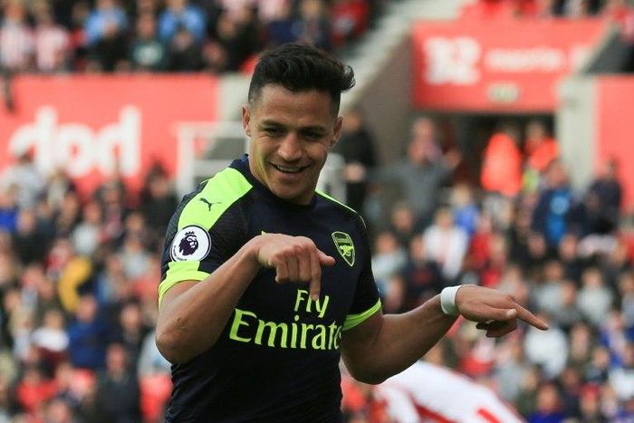 Arsenal's striker Alexis Sanchez celebrates after scoring their third goal during the English Premier League football match against Stoke City May 13, 2017
