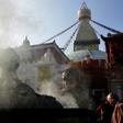A Buddhist devotee lights incense at Kathmandu's Boudhanath stupa on November 22, 2016