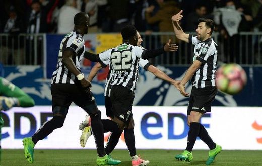 Angers' French midfielder Thomas Mangani (R) celebrates after scoring during the French Cup semi-final football match between Angers and Guingamp on April 25, 2017
