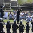 Riot police control inmates at a juvenile detention center in San Jose Pinula, east of Guatemala City, following a deadly prison riot
