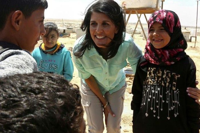 US Ambassador to the UN Nikki Haley talks to Syrian refugees during a visit to the Zaatari refugee camp on the Jordanian border with Syria on May 21, 2017