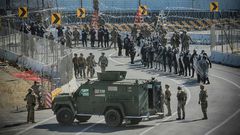 US troops pictured in November 2018 at the San Ysidro border crossing, where 20 Central American asylum seekers a day are expected to be returned by the US