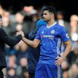Chelsea's head coach Antonio Conte (L) embraces Chelsea's striker Diego Costa (R) during the English Premier League football match against Arsenal February 4, 2017