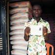 Mike Esorae displays document that denied his stay in France at his cement shop, Idogbo village, in midwest Nigeria, on October 21, 2016