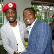 File image of Samwel Ragira (R) with Ugandan MP Bobi Wine