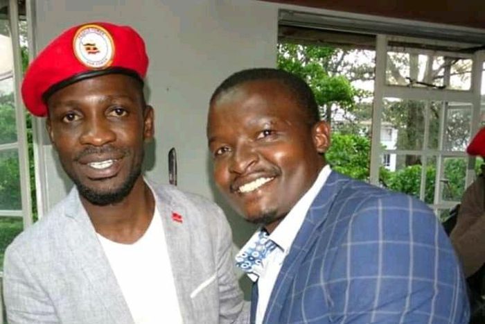 File image of Samwel Ragira (R) with Ugandan MP Bobi Wine