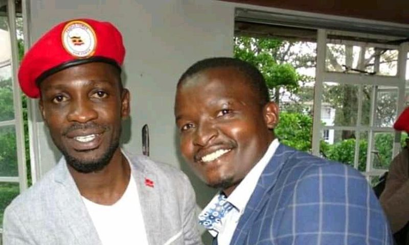 File image of Samwel Ragira (R) with Ugandan MP Bobi Wine