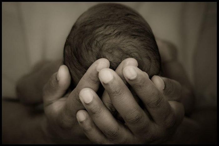 A person holding a baby