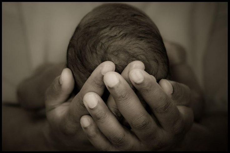 A person holding a baby