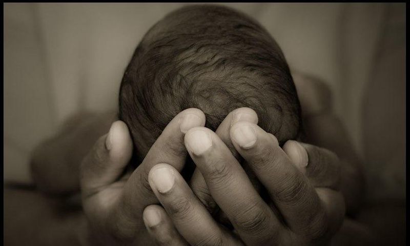 A person holding a baby