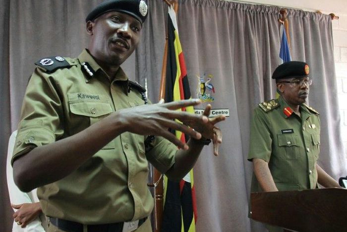 Ugandan police spokesman Andrew Kaweesi (Left) was shot and killed as he left his home in Kampala