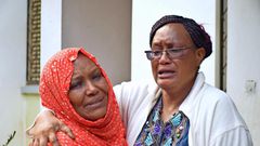 Kamto's wife Fauzia with a relative when her husband was pronounced dead (Twitter)