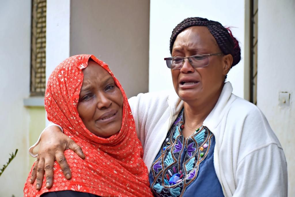 Kamto's wife Fauzia with a relative when her husband was pronounced dead (Twitter)