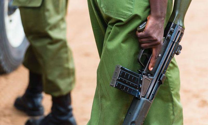 A Kenyan police officer holding a gun (Courtesy)