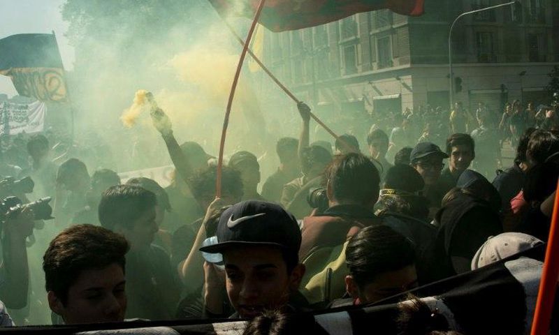 Students march to demand the government to speed up a long-awaited reform to guarantee universal access to free public education, in Santiago on April 11, 2017