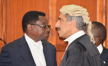Queen's Counsel Khawar Qureshi with Senior Counsel James Orengo in Court