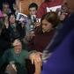 Bishop Manuel Acuna (L) performs a ritual at the 'El Buen Pastor' parish in Santos Lugares, on the outskirts of Buenos Aires