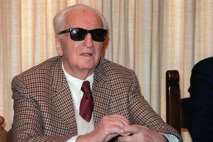 Formula One legend Enzo Ferrari, pictured in March 1987, is buried in a cemetery in Modena behind a plate of marble in a large chapel secured by a heavy iron gate
