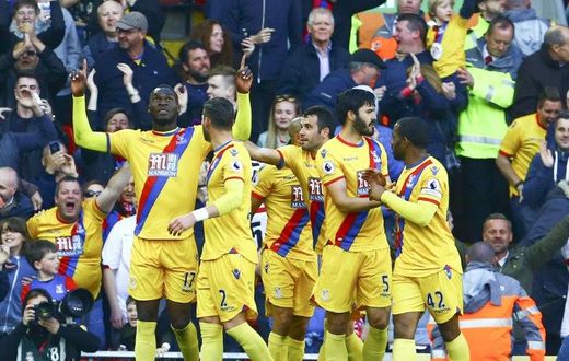 Crystal Palace's striker Christian Benteke (L) celebrates scoring a goal against Liverpool with Joel Ward (2ndL), James Tomkins (2ndR) and Jason Puncheon on April 23, 2017