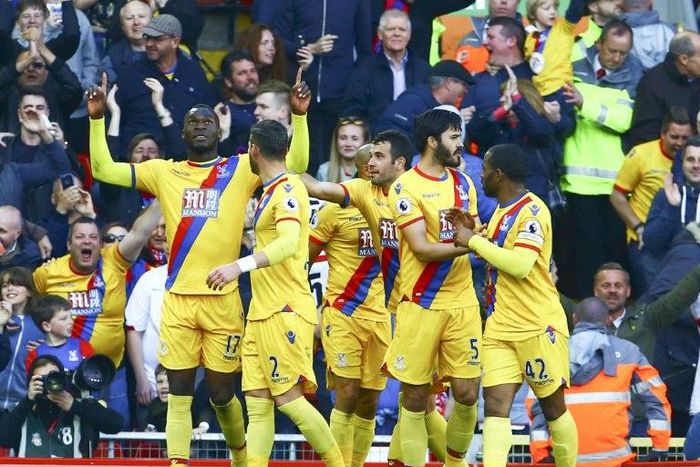 Crystal Palace's striker Christian Benteke (L) celebrates scoring a goal against Liverpool with Joel Ward (2ndL), James Tomkins (2ndR) and Jason Puncheon on April 23, 2017