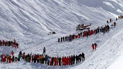 Rescuers work in an off-piste area after an avalanche engulfed nine people, killing at least four, in Tignes, in the French Alps, in a picture made available by Radio Val d'Isere on Febuary 13, 2017