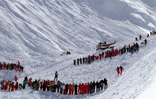Rescuers work in an off-piste area after an avalanche engulfed nine people, killing at least four, in Tignes, in the French Alps, in a picture made available by Radio Val d'Isere on Febuary 13, 2017