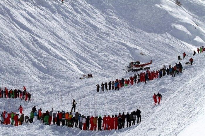 Rescuers work in an off-piste area after an avalanche engulfed nine people, killing at least four, in Tignes, in the French Alps, in a picture made available by Radio Val d'Isere on Febuary 13, 2017