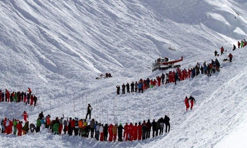 Rescuers work in an off-piste area after an avalanche engulfed nine people, killing at least four, in Tignes, in the French Alps, in a picture made available by Radio Val d'Isere on Febuary 13, 2017