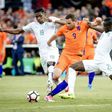 Netherlands' Vincent Janssen (C) clashes with Simon Deli (L) and Eric Bailly of Ivory Coast during a football match in Rotterdam on June 4, 2017