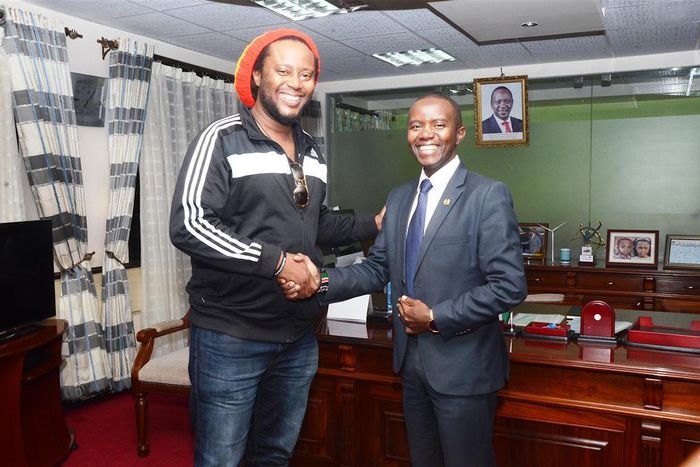 ICT Cabinet Secretary Joe Mucheru (right) with Jamaican Reggae star Duane Stephenson who paid him a courtesy call at his Teleposta Towers office, Nairobi.
