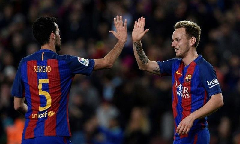 Ivan Rakitic (R) has won eight trophies since joining Barcelona from Sevilla in 2014